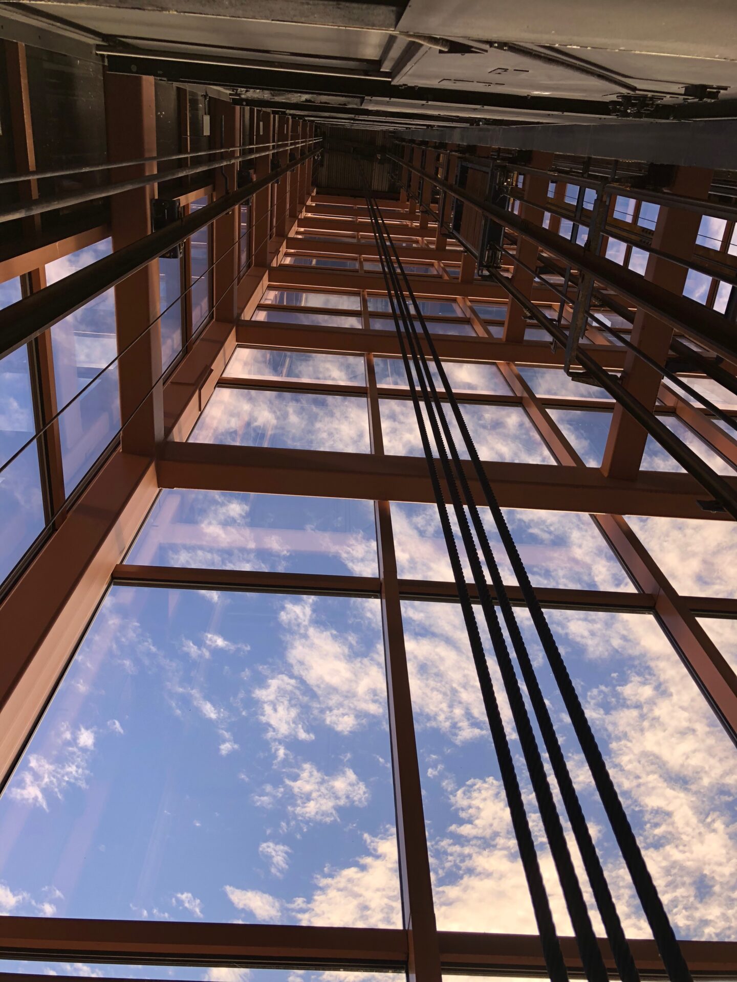 A view of the sky from inside a building.