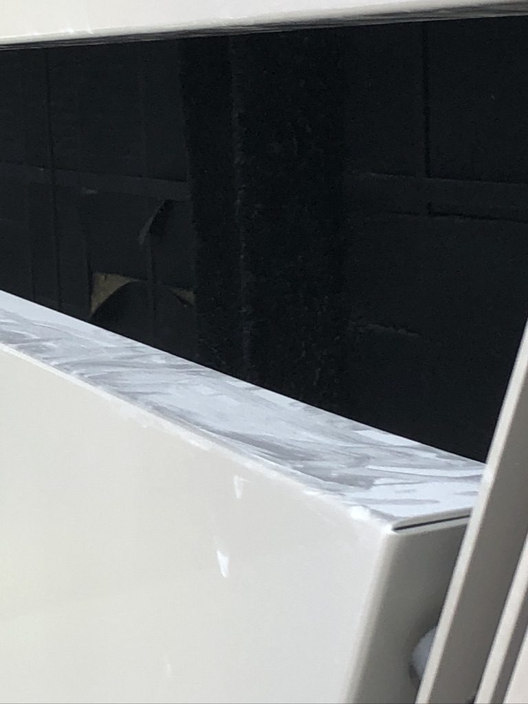 A white bathtub sitting in the middle of a bathroom.